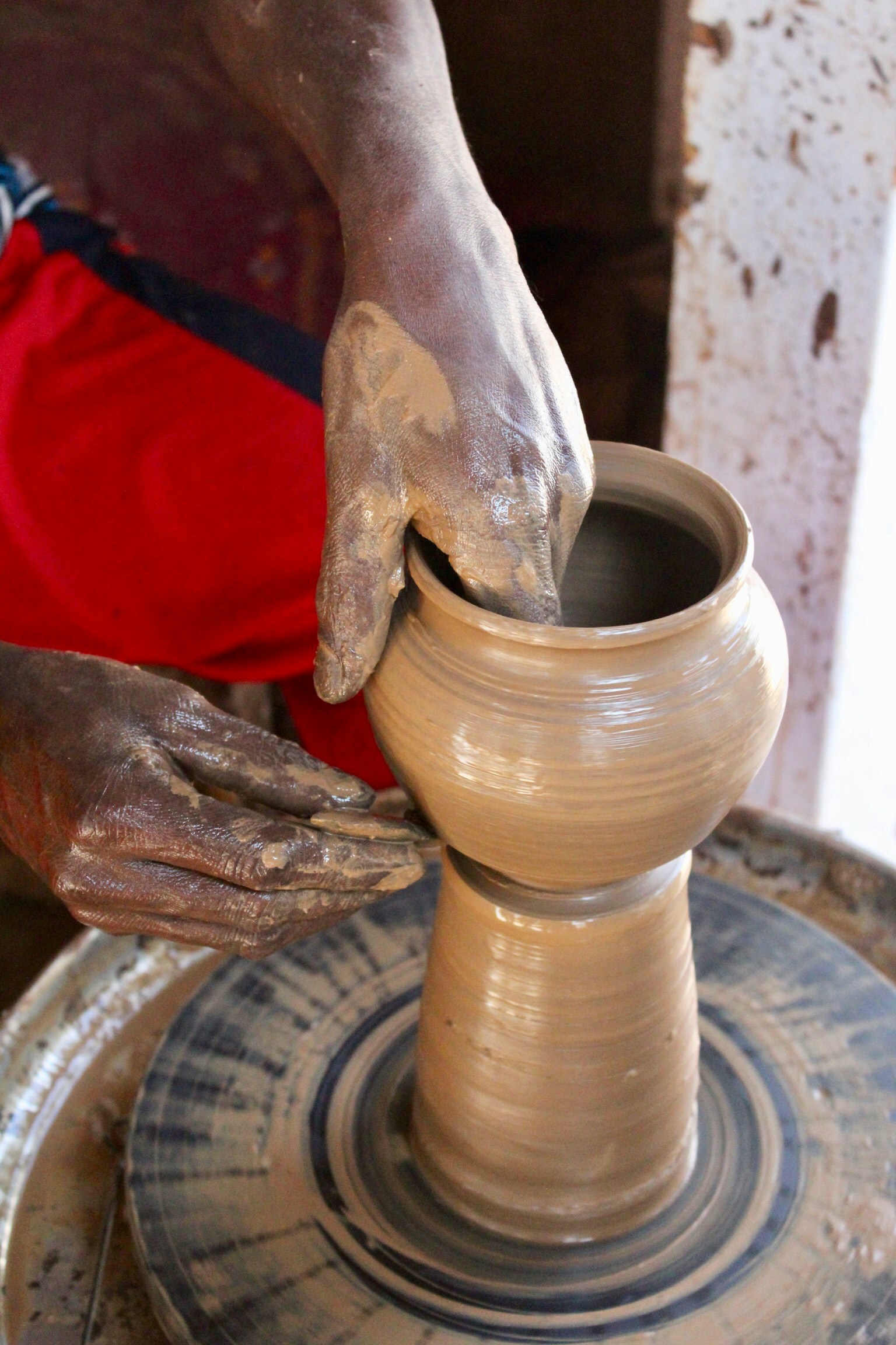 Artisan shaping clay